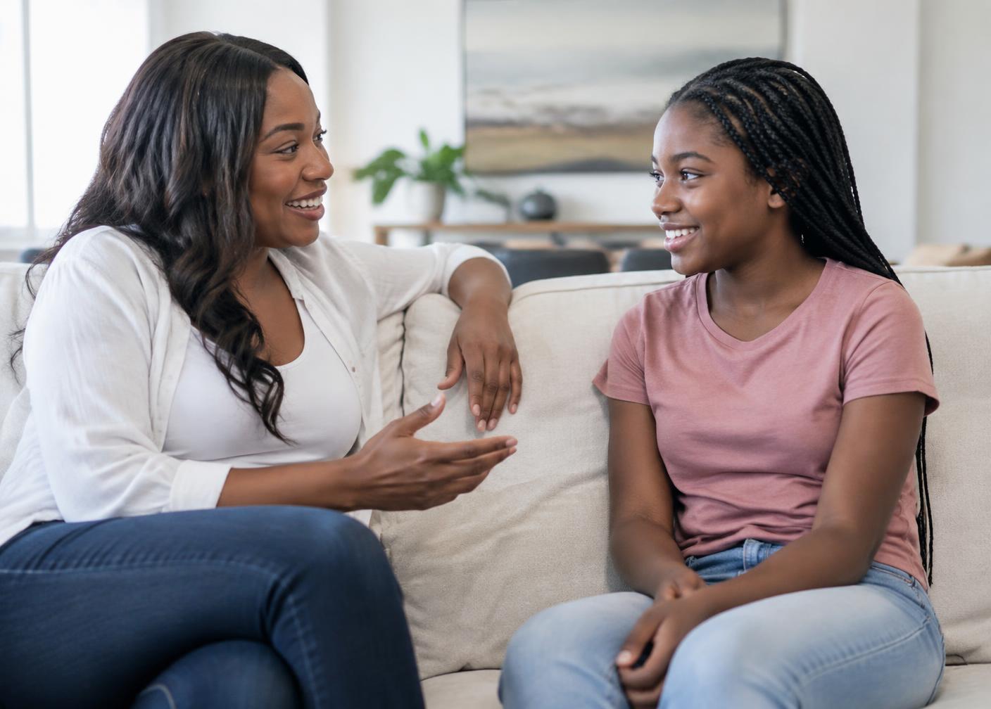 Mentor and young Black girl in conversation
